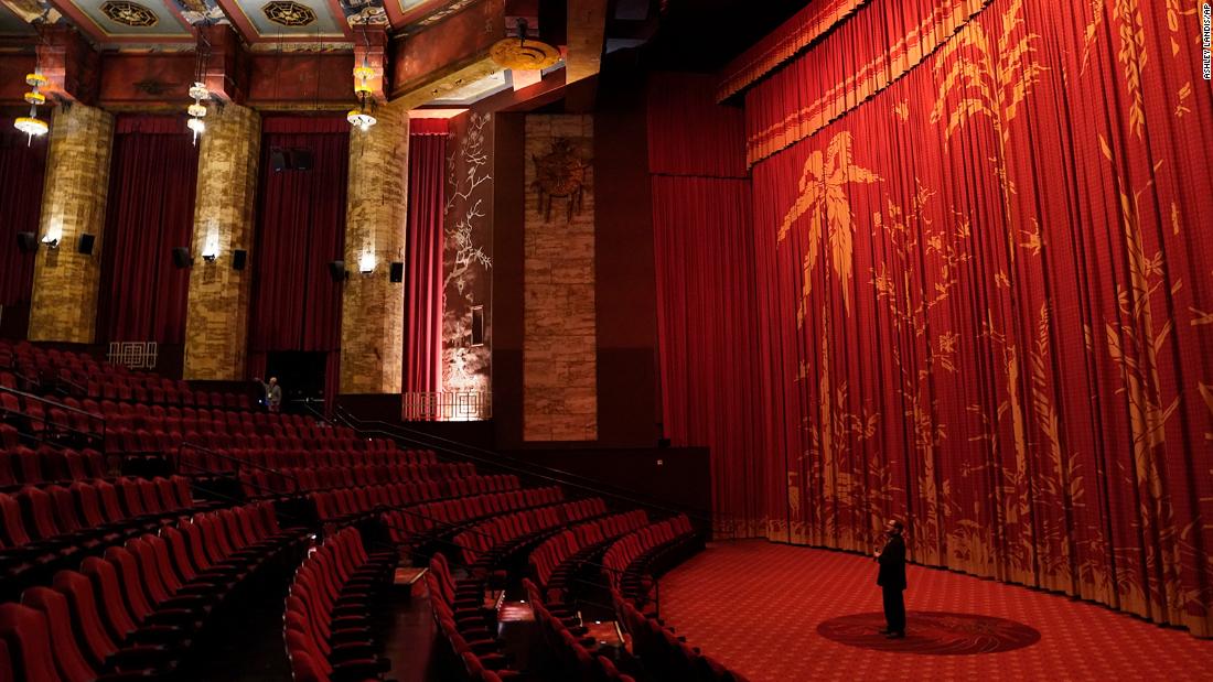 Levi Tinker, resident historian and general manager of the TCL Chinese Theatre in Hollywood, makes an announcement inside the theater&#39;s empty auditorium on May 18. It was the theater&#39;s 93rd birthday celebration.